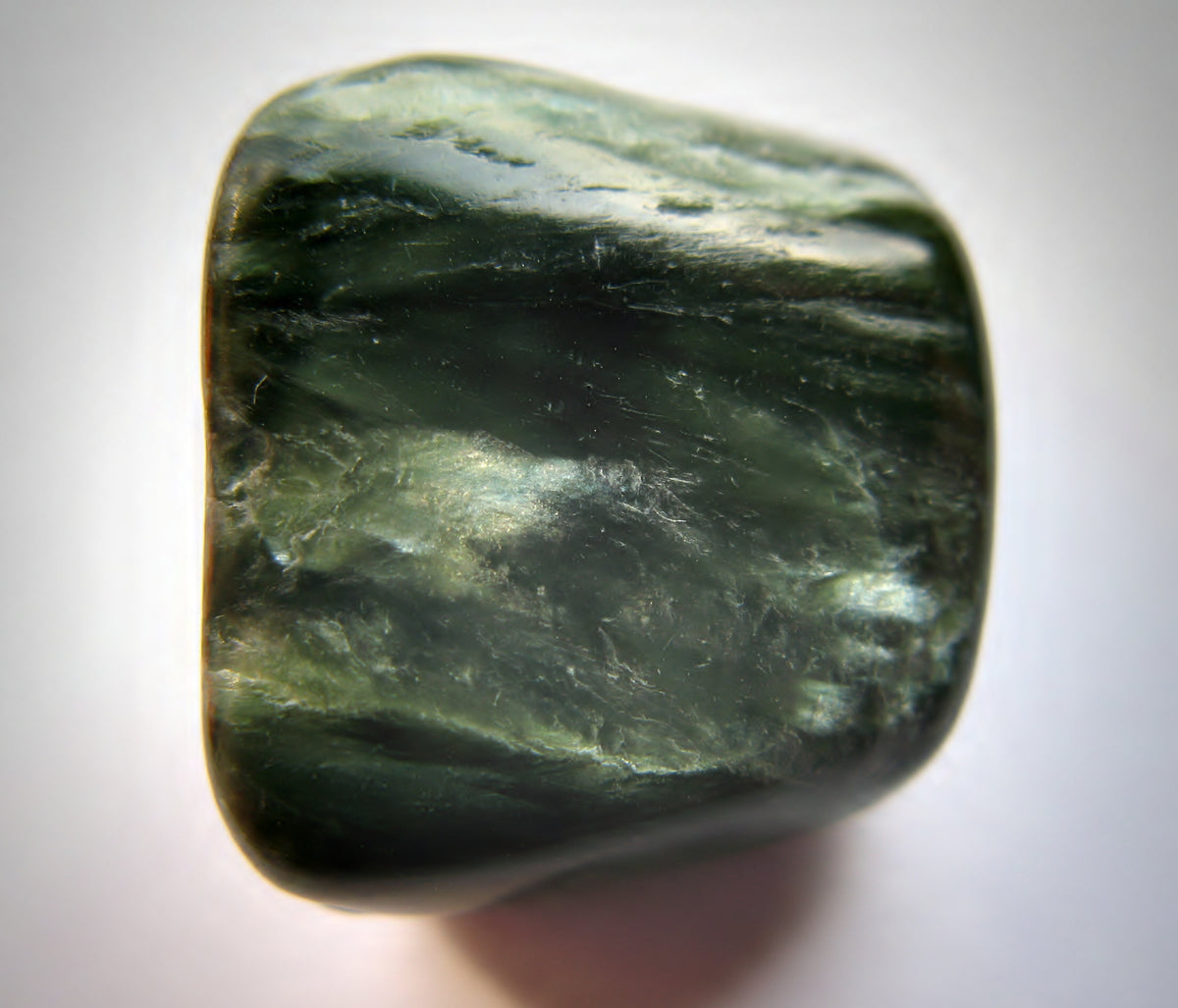 Clinochlore variety Seraphinite showing green material with silvery radiating patterns. Photo by Ra'ike, CC BY 3.0 via Wikimedia Commons.