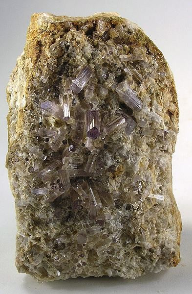 Scapolite crystals from Badakhshan, Afghanistan. Photo by Robert M. Lavinsky / iRocks.com, CC BY-SA 3.0 via Wikimedia Commons.