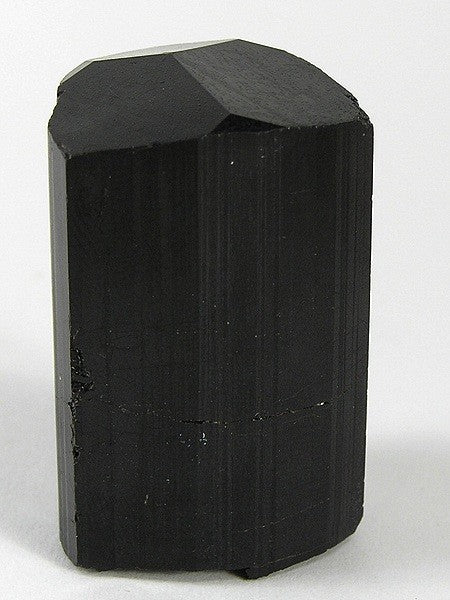 Schorl (black tourmaline) crystal specimen from the Alto Ligonha pegmatite district, Mozambique. Photo by Robert M. Lavinsky / iRocks.com, CC BY-SA 3.0 via Wikimedia Commons.