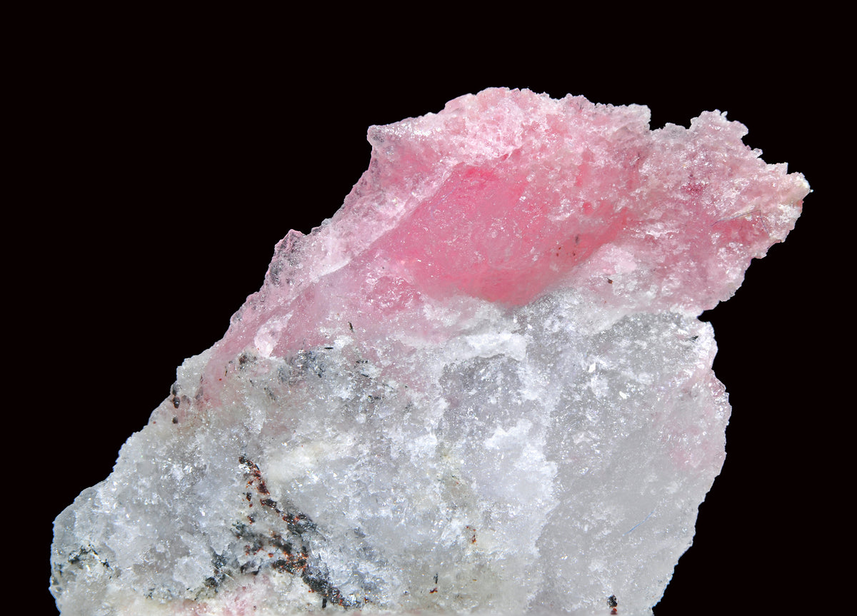 Tugtupite from the Ilímaussaq complex, Greenland. Photo by Géry Parent, CC BY-SA 3.0 via Wikimedia Commons.