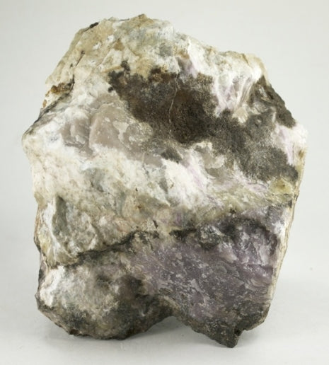 Lavender Ussingite with pale Sodalite from the Ilímaussaq complex, Greenland. Photo by Robert M. Lavinsky / iRocks.com, CC BY-SA 3.0 via Wikimedia Commons.