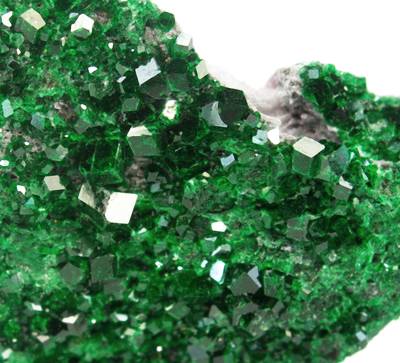 Emerald-green Uvarovite garnet crystals. Photo by Robert M. Lavinsky / iRocks.com, CC BY-SA 3.0 via Wikimedia Commons.