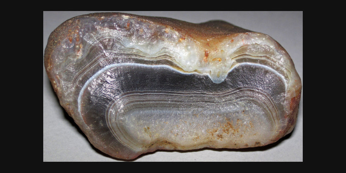 Botswana Agate specimen; photo by James St. John, CC BY 2.0 — Roosters Peacock crystal guide