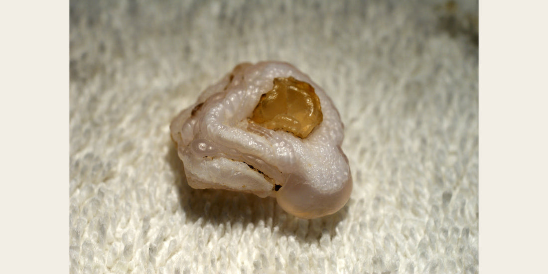 Natural chalcedony specimen; photo by Teravolt, CC BY 3.0 — Roosters Peacock crystal guide