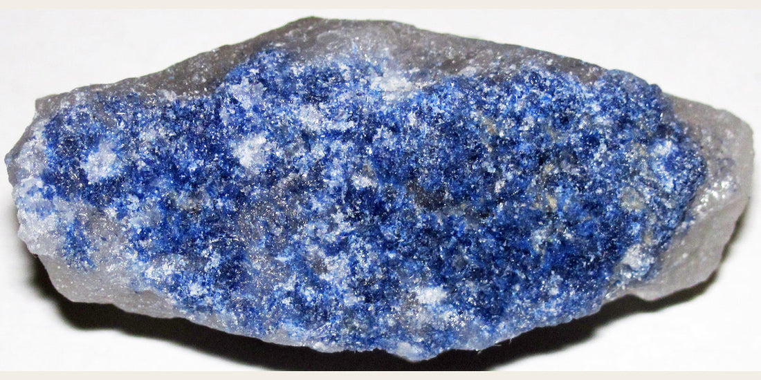 Dumortierite-included quartz from Brazil; photo by James St. John — Roosters Peacock crystal guide