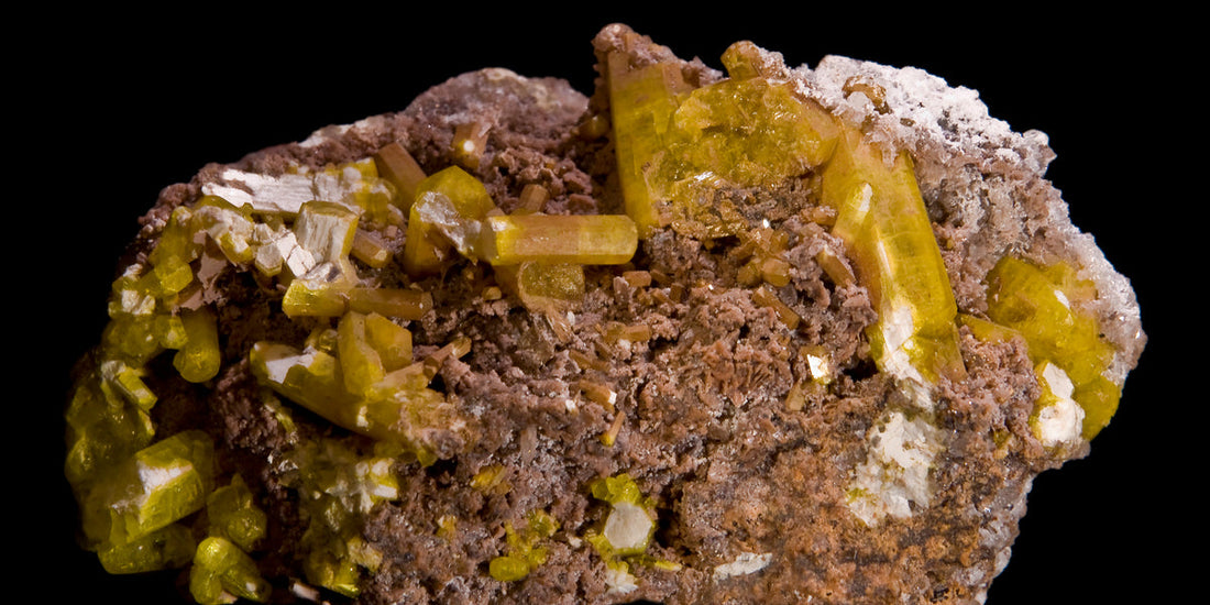 Ettringite specimen from N'Chwaning Mines, South Africa; photo by Didier Descouens, CC BY-SA 3.0 — Roosters Peacock crystal guide
