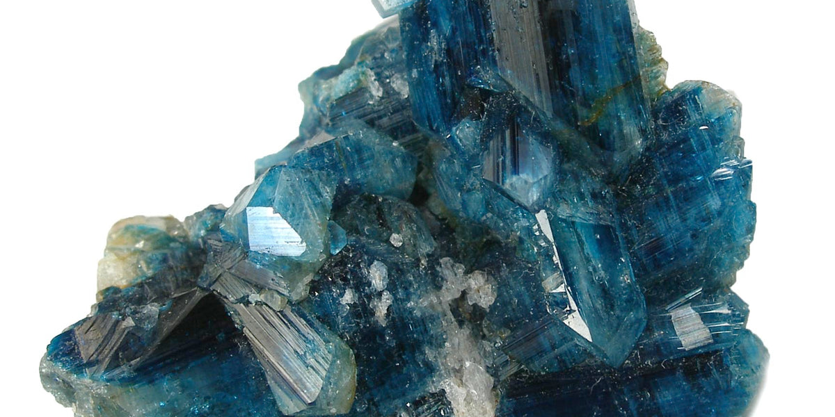 Euclase crystal specimen; photo by Robert M. Lavinsky, CC BY-SA 3.0 — Roosters Peacock crystal guide