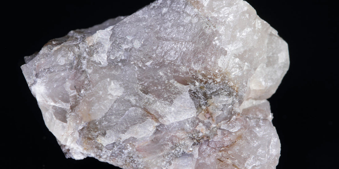 Eucryptite specimen from Finland; photo by Jyrki Autio, public domain — Roosters Peacock crystal guide