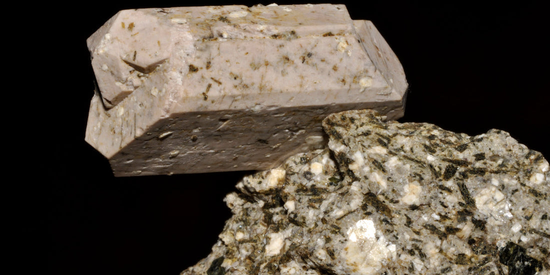 Orthoclase feldspar specimen from Brazil; photo by Géry Parent, public domain — representative of the Feldspar Group, Roosters Peacock crystal guide