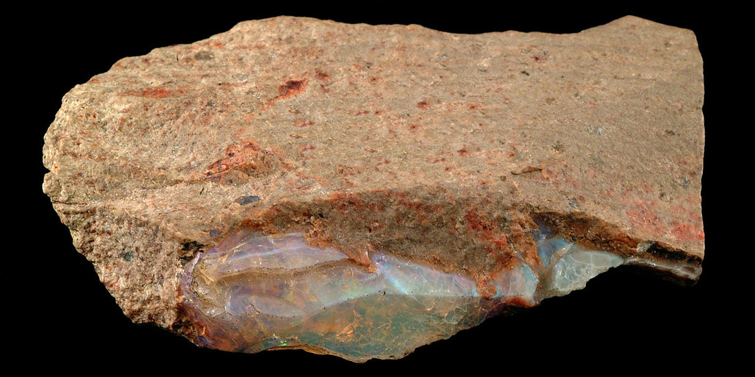 Fire opal specimen; photo by Shannon Heinle, CC0 — Roosters Peacock crystal guide