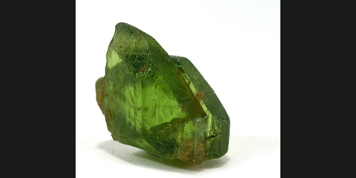 Forsterite olivine specimen from St. John's Island, Egypt; photo by Robert M. Lavinsky, CC BY-SA 3.0 — Roosters Peacock crystal guide
