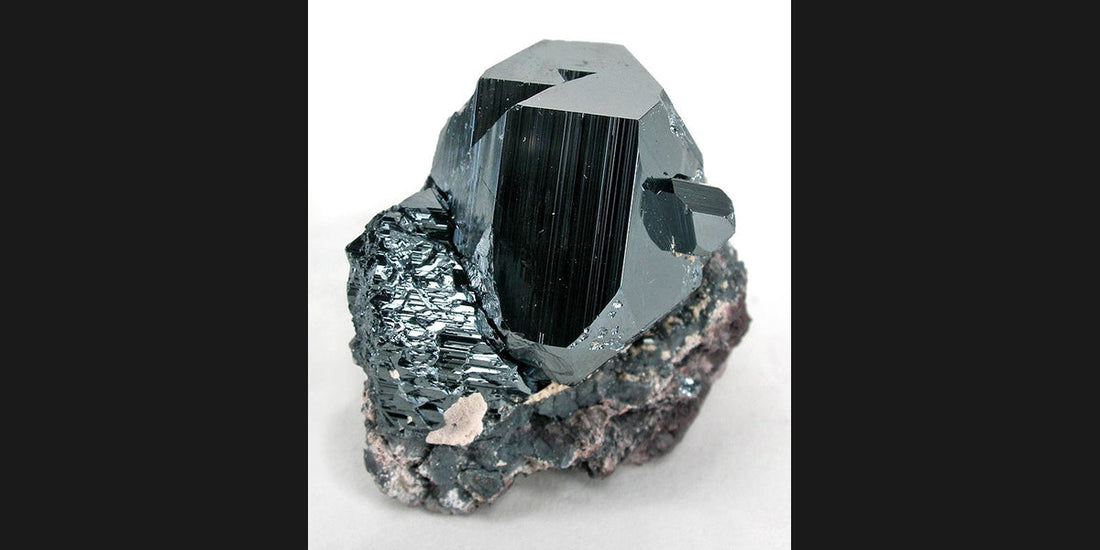 Hematite specimen from South Africa; photo by Robert M. Lavinsky, CC BY-SA 3.0 — Roosters Peacock crystal guide