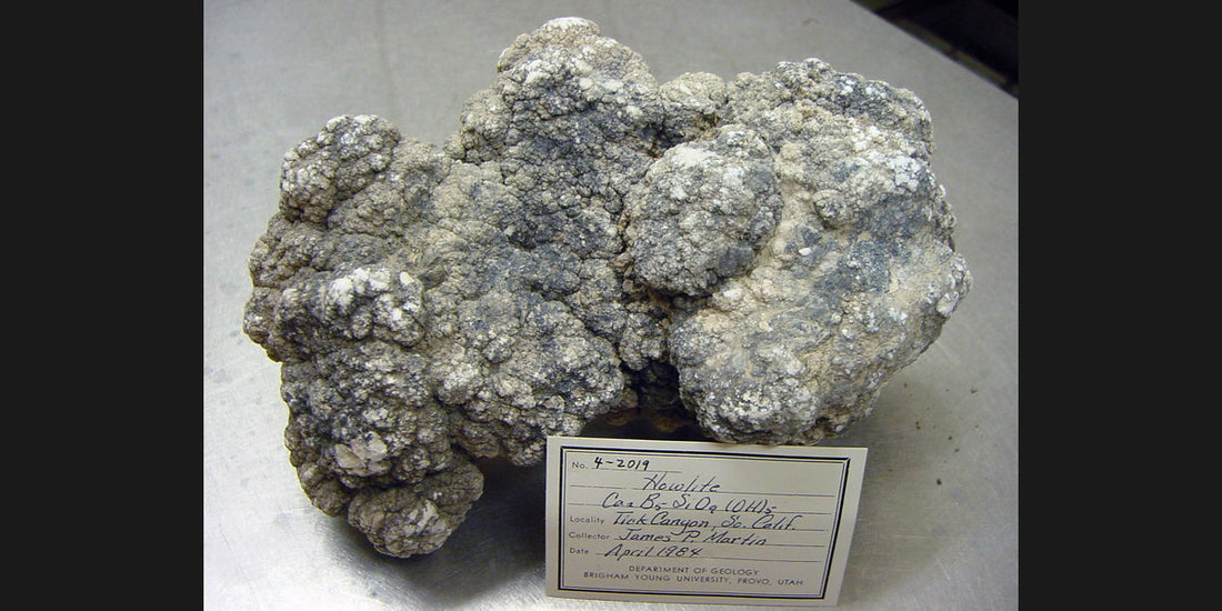 Natural howlite specimen from California; USGS public-domain photo — Roosters Peacock crystal guide