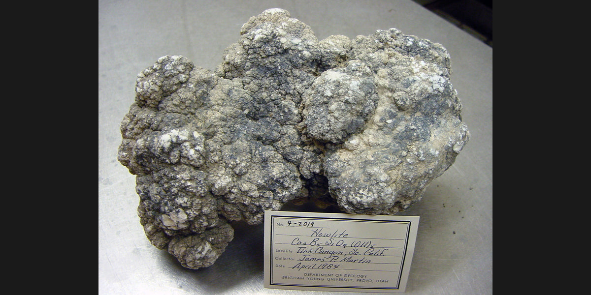 Natural howlite specimen from California; USGS public-domain photo — Roosters Peacock crystal guide