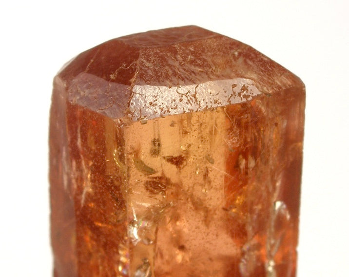 Imperial Topaz crystal from Ouro Preto, Brazil; Rob Lavinsky, iRocks.com, CC BY-SA 3.0 — Roosters Peacock crystal guide