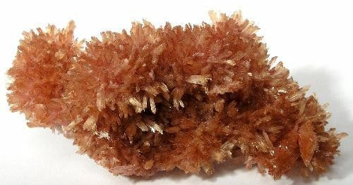 Natural inesite crystal specimen from N'Chwaning Mines, South Africa; Rob Lavinsky, iRocks.com, CC BY-SA 3.0 — Roosters Peacock crystal guide