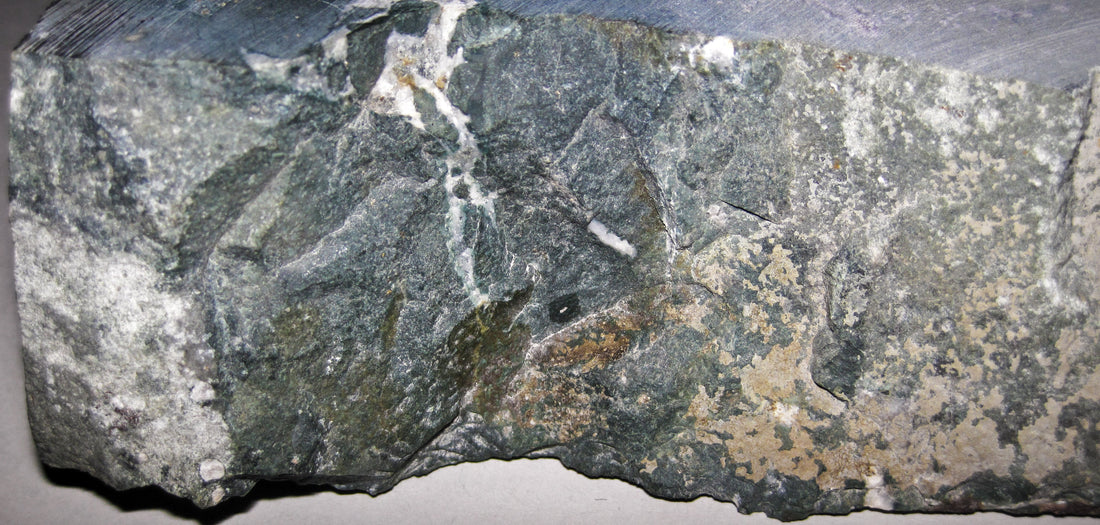 Natural nephrite jade specimen from Oregon, USA; photograph by James St. John, CC BY 2.0 — representative jade specimen for Roosters Peacock crystal guide