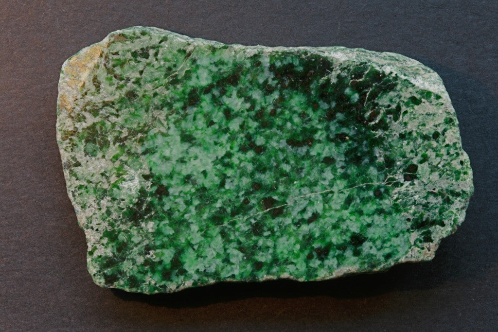 Natural jadeite specimen from the Hpakant-Tawmaw Jade Tract, Myanmar; Ralph Bottrill, CC BY 3.0 — Roosters Peacock crystal guide
