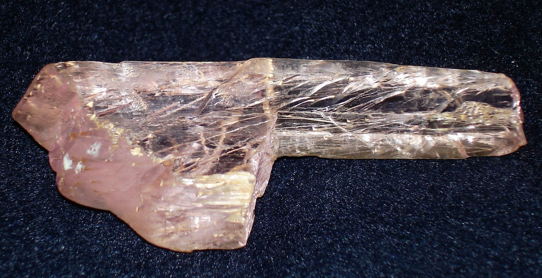 Natural pink kunzite crystal, a gem variety of spodumene, from Minas Gerais, Brazil; Eurico Zimbres and Tom Epaminondas, CC BY-SA 2.5 — Roosters Peacock crystal guide