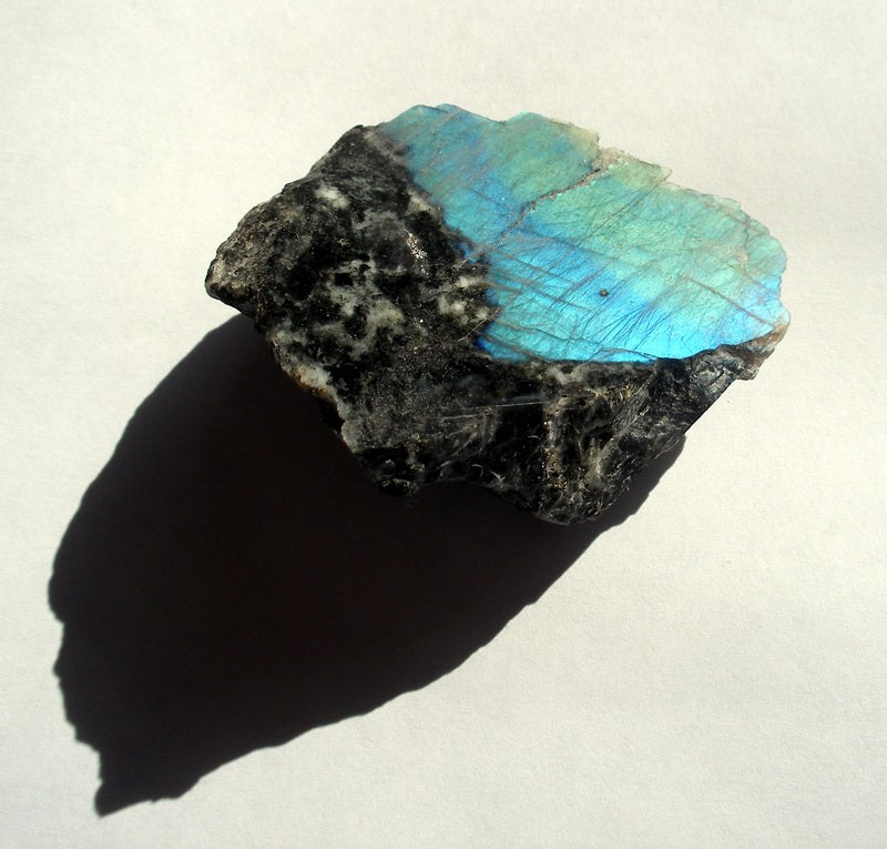 Natural labradorite specimen showing labradorescence; Arenamontanus, CC BY 2.0 — Roosters Peacock crystal guide