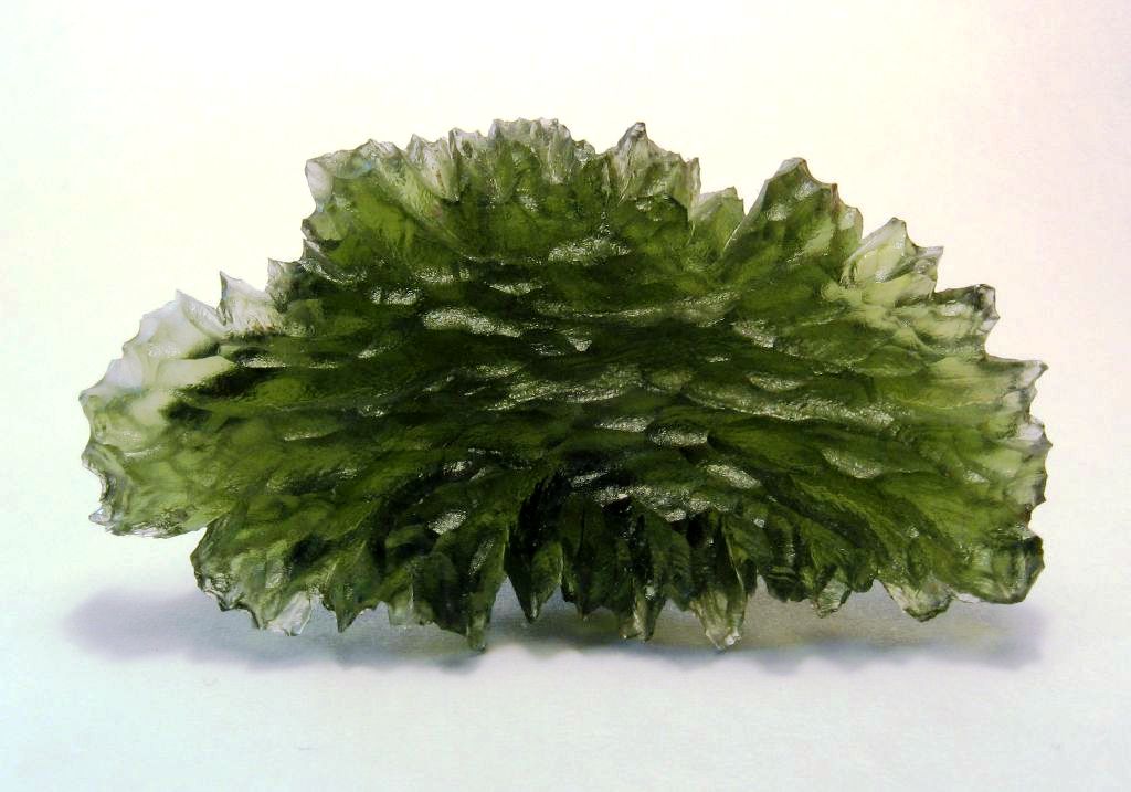 Natural moldavite tektite from Besednice, Bohemia, Czech Republic; H. Raab, CC BY-SA 3.0 — Roosters Peacock crystal guide