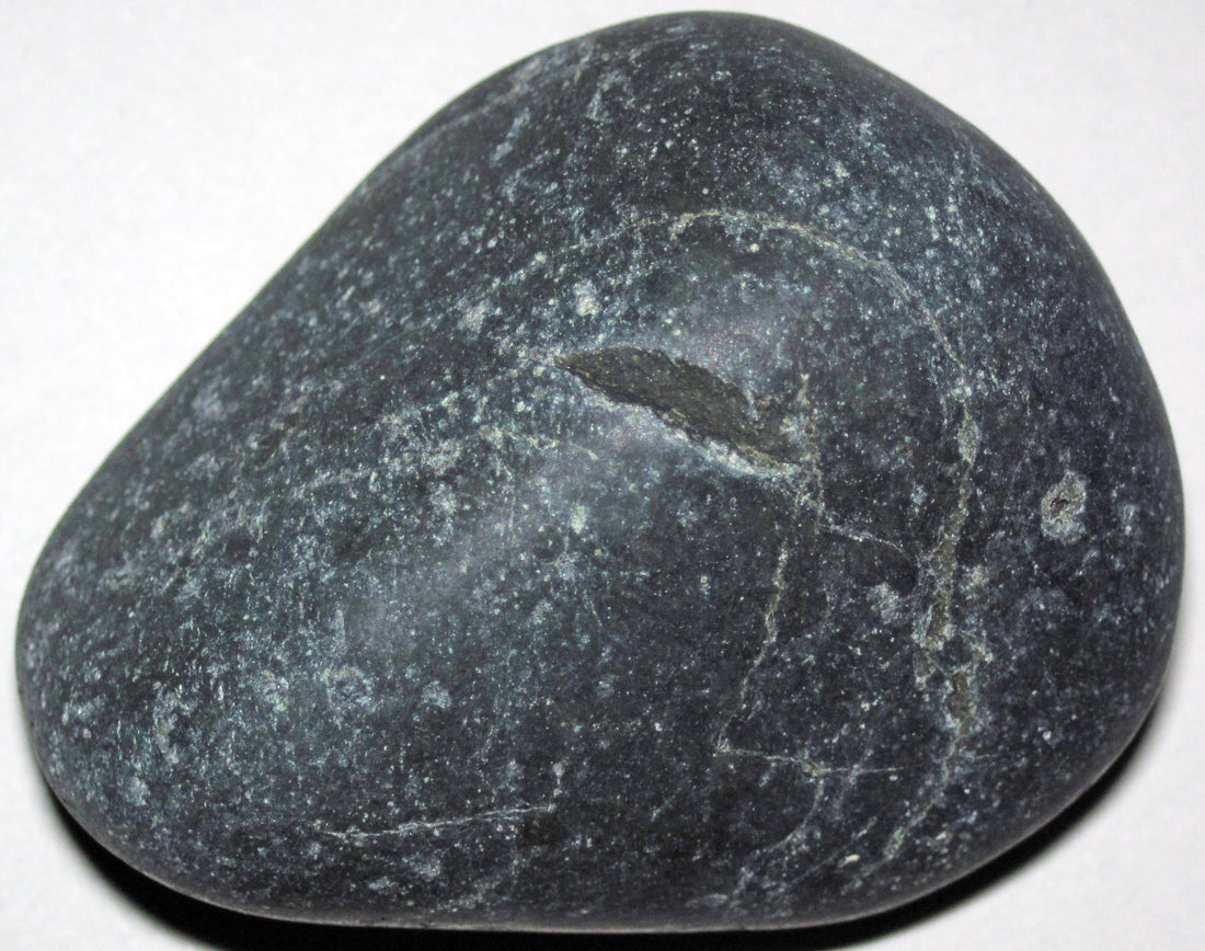 Natural nephrite jade from the Susitna River near Talkeetna, Alaska; James St. John, CC BY 2.0 — Roosters Peacock crystal guide