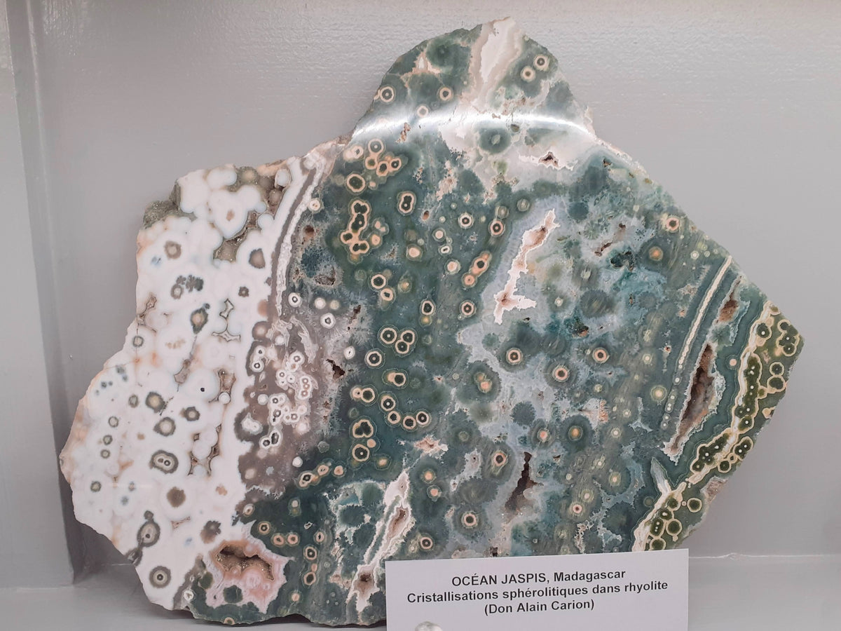 Ocean Jasper from Madagascar on display at the Musée de Minéralogie in Paris; Animalculum, CC BY 4.0 — Roosters Peacock crystal guide