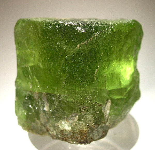 Natural olivine (peridot) crystal from Møre og Romsdal, Norway; Rob Lavinsky, CC BY-SA 3.0 — Roosters Peacock crystal guide