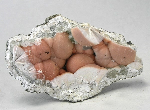 Natural pectolite specimen from Millington Quarry, New Jersey; Rob Lavinsky, iRocks.com, CC BY-SA 3.0 — Roosters Peacock crystal guide