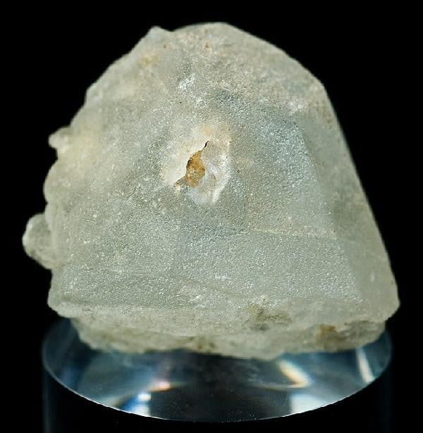 Natural pollucite crystal from Paprok, Nuristan, Afghanistan; Rob Lavinsky, CC BY-SA 3.0 — Roosters Peacock crystal guide