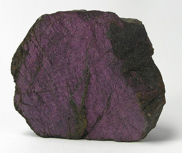 Natural purple purpurite specimen from Sandamab pegmatite, Namibia; Rob Lavinsky, CC BY-SA 3.0 — Roosters Peacock crystal guide