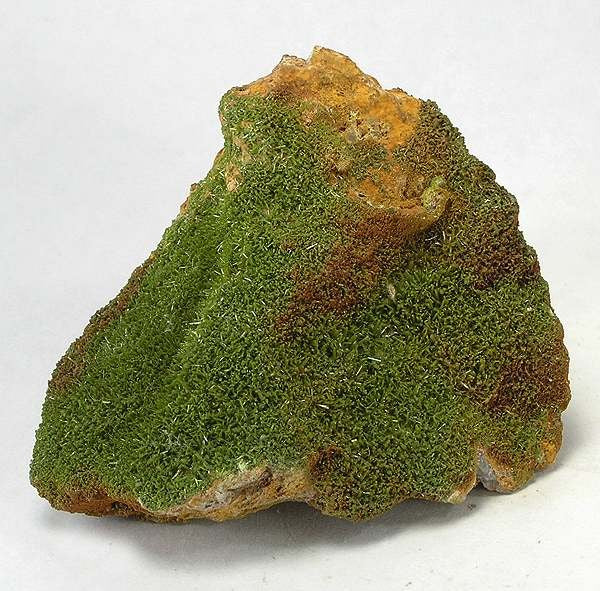Natural bright green pyromorphite crystals from the Schauinsland mining district, Germany; Rob Lavinsky, CC BY-SA 3.0 — Roosters Peacock crystal guide