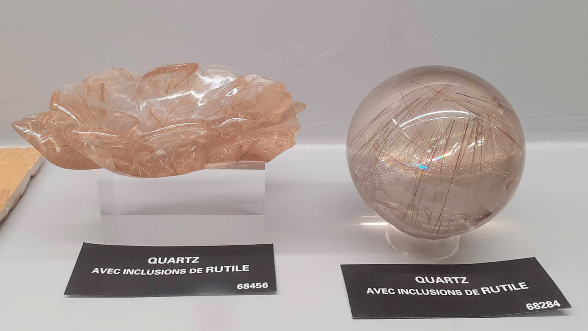 Natural rutilated quartz specimen showing rutile inclusions; Musée de Minéralogie, Paris; Animalculum, CC BY 4.0 — Roosters Peacock crystal guide