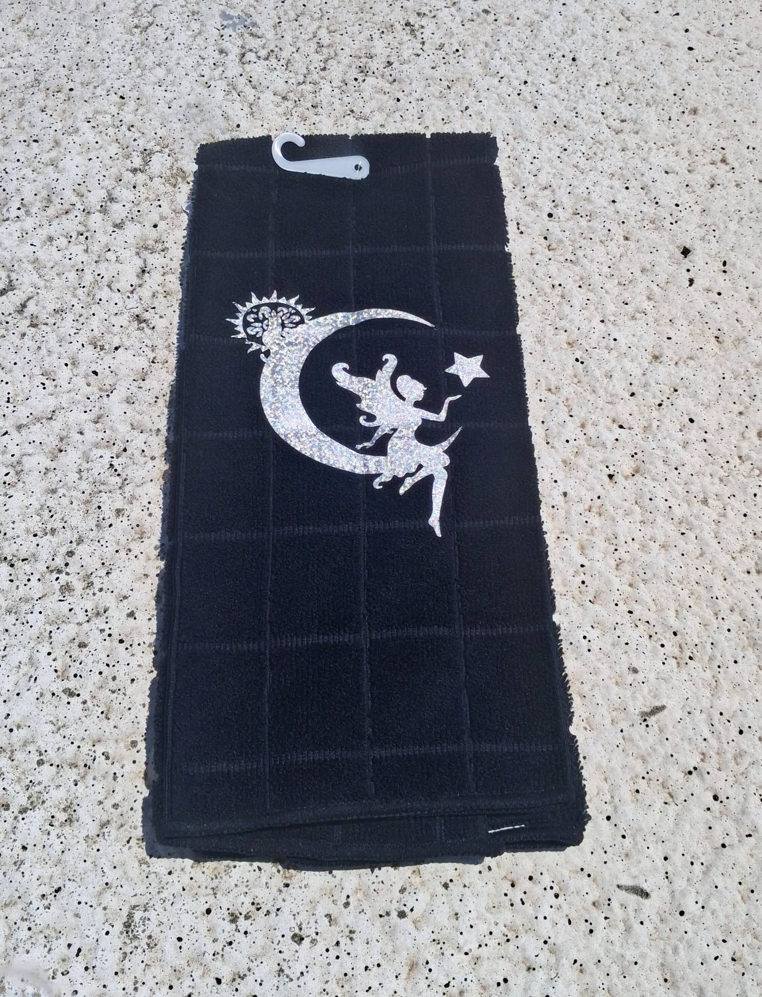 Black fairy moon hand towel plain back view showing grid waffle texture