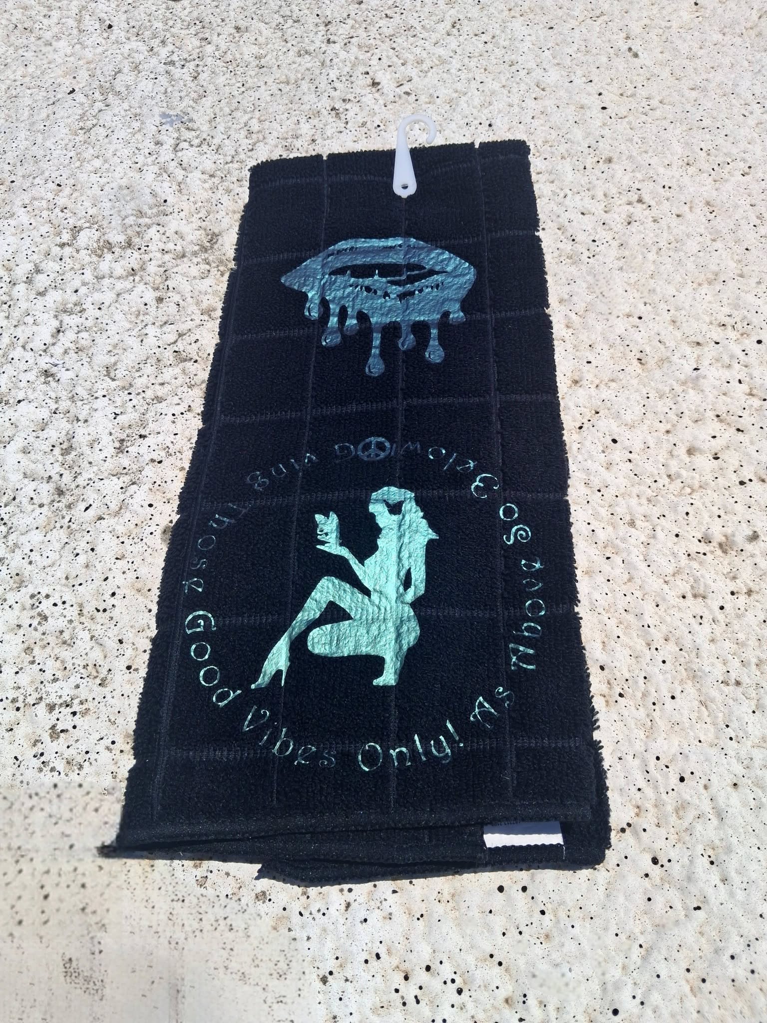 Black microfiber Good Vibes Only hand towel close up of teal dripping lips design with hook clip