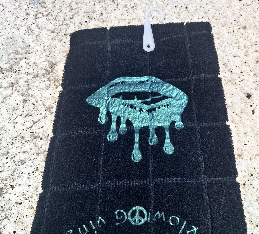 Gray microfiber Good Vibes Only As Above So Below hand towel full view with teal design on concrete