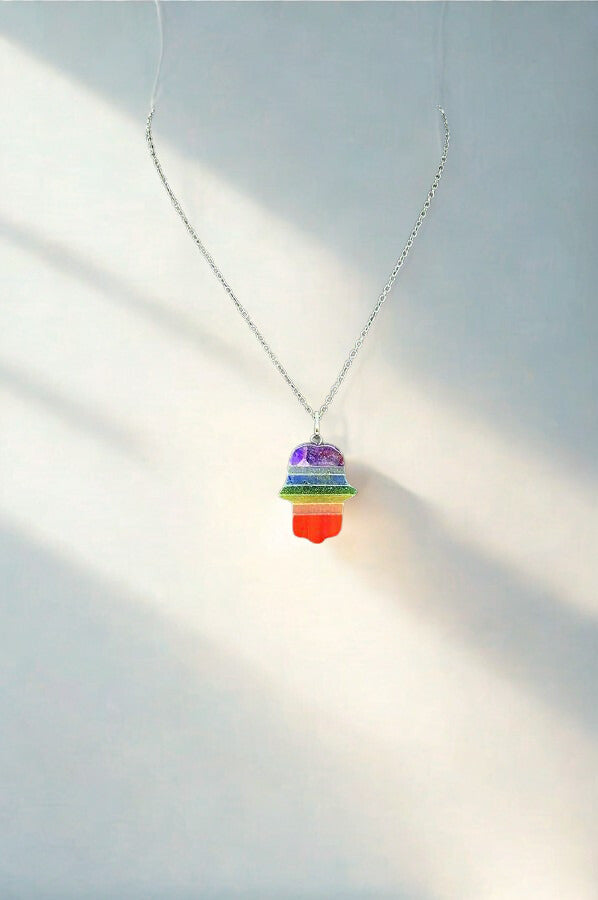 Beautiful 7 chakra bonded gemstone Hamsa pendant, approx. 1.5 inches. Hand-shaped design with layered chakra stones for protection, harmony, and positive energy – perfect spiritual jewelry.