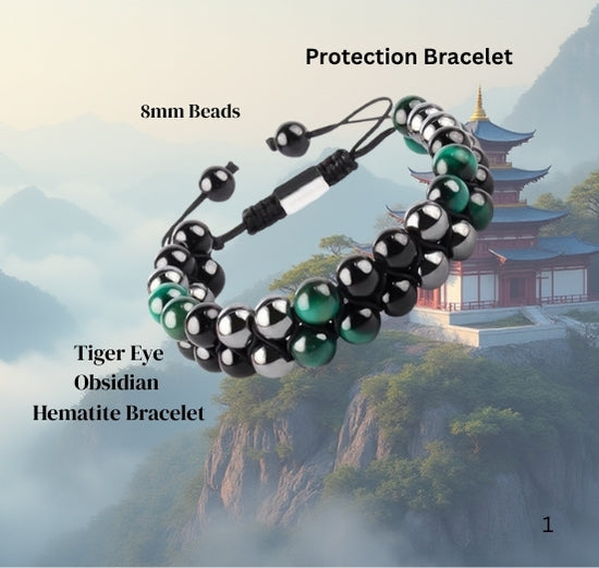 Protection bracelet with tiger eye, obsidian, and hematite beads against a mountainous background.