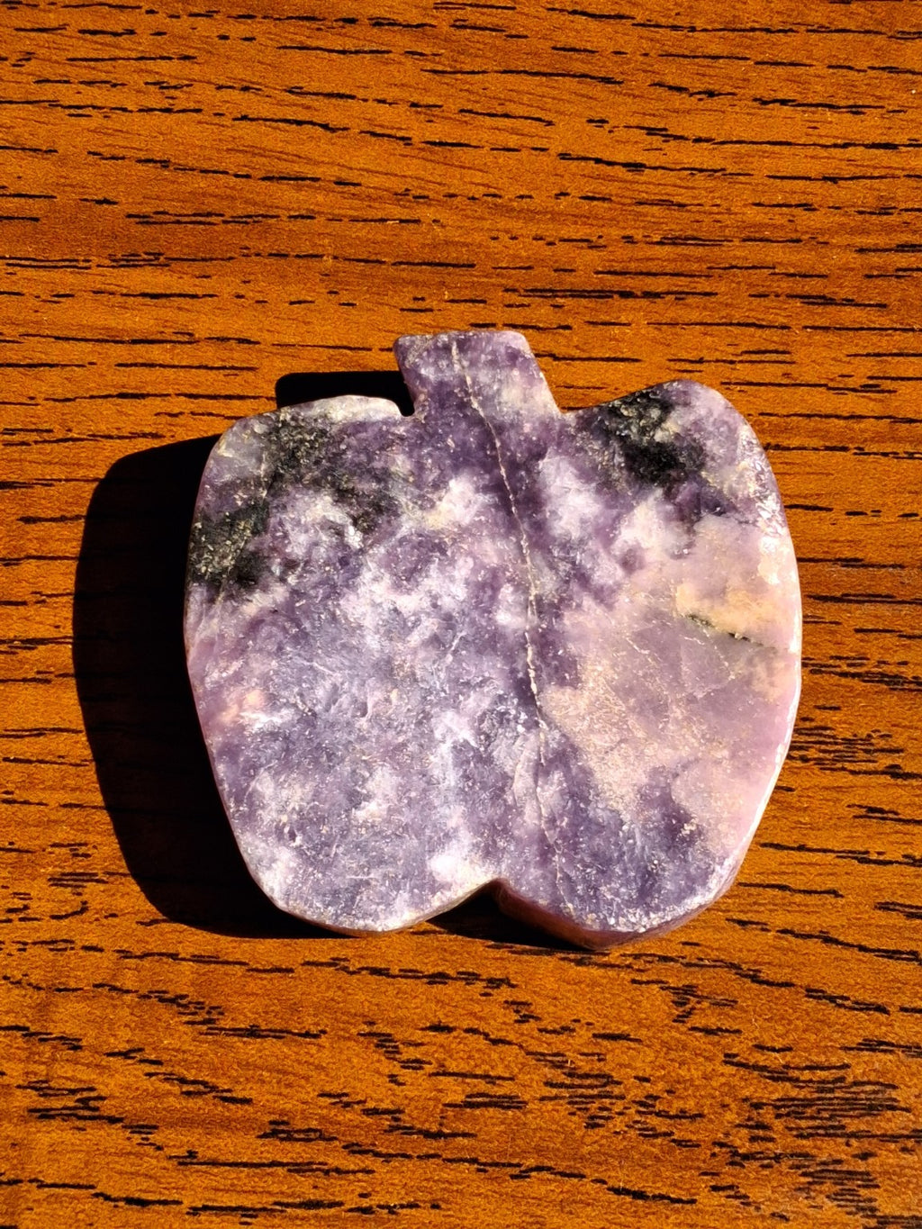 Original amethyst pumpkin stone lying flat showing lavender and cream mineral marbling