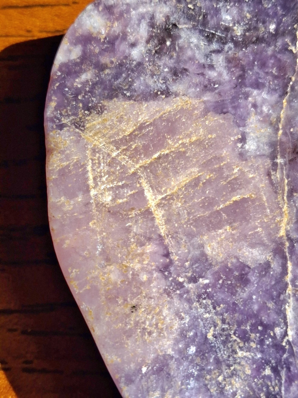 Close-up natural pale veins and violet marbling on amethyst pumpkin