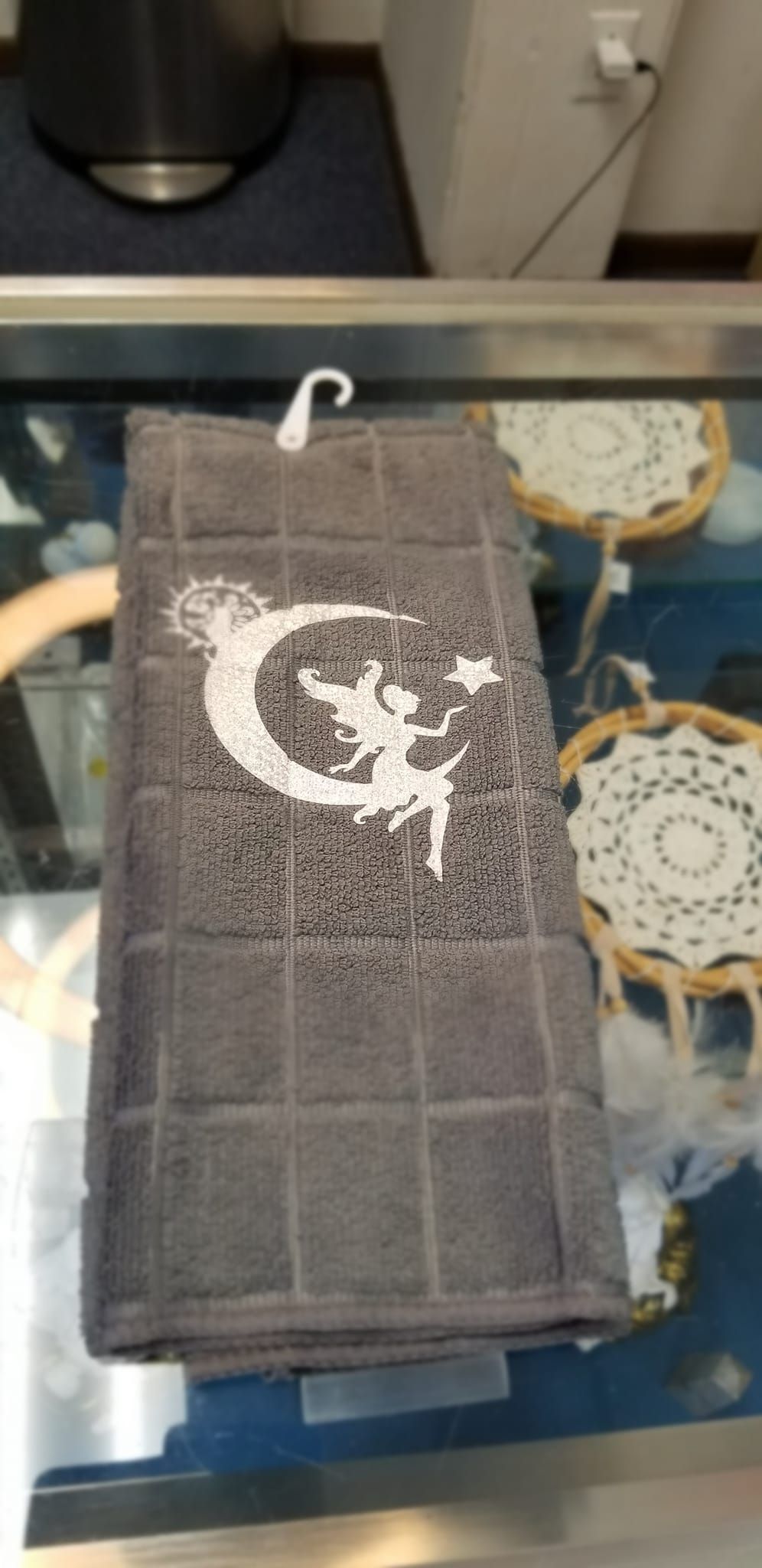 Gray fairy moon hand towel close up showing silver glitter design detail with star accent
