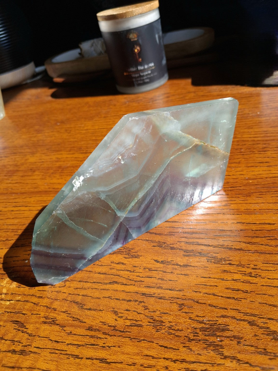 Rainbow Fluorite slab natural green lavender purple banded translucent irregular polished mineral, full oblique view