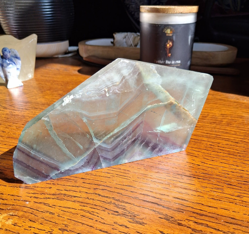Rainbow Fluorite crystal elongated slab thin green to violet natural banding angled photo