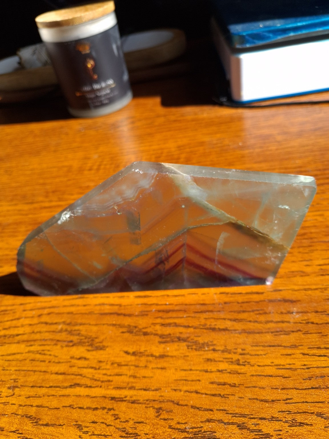 Side profile of 1/4 inch thin Rainbow Fluorite slab showing polished narrow edge