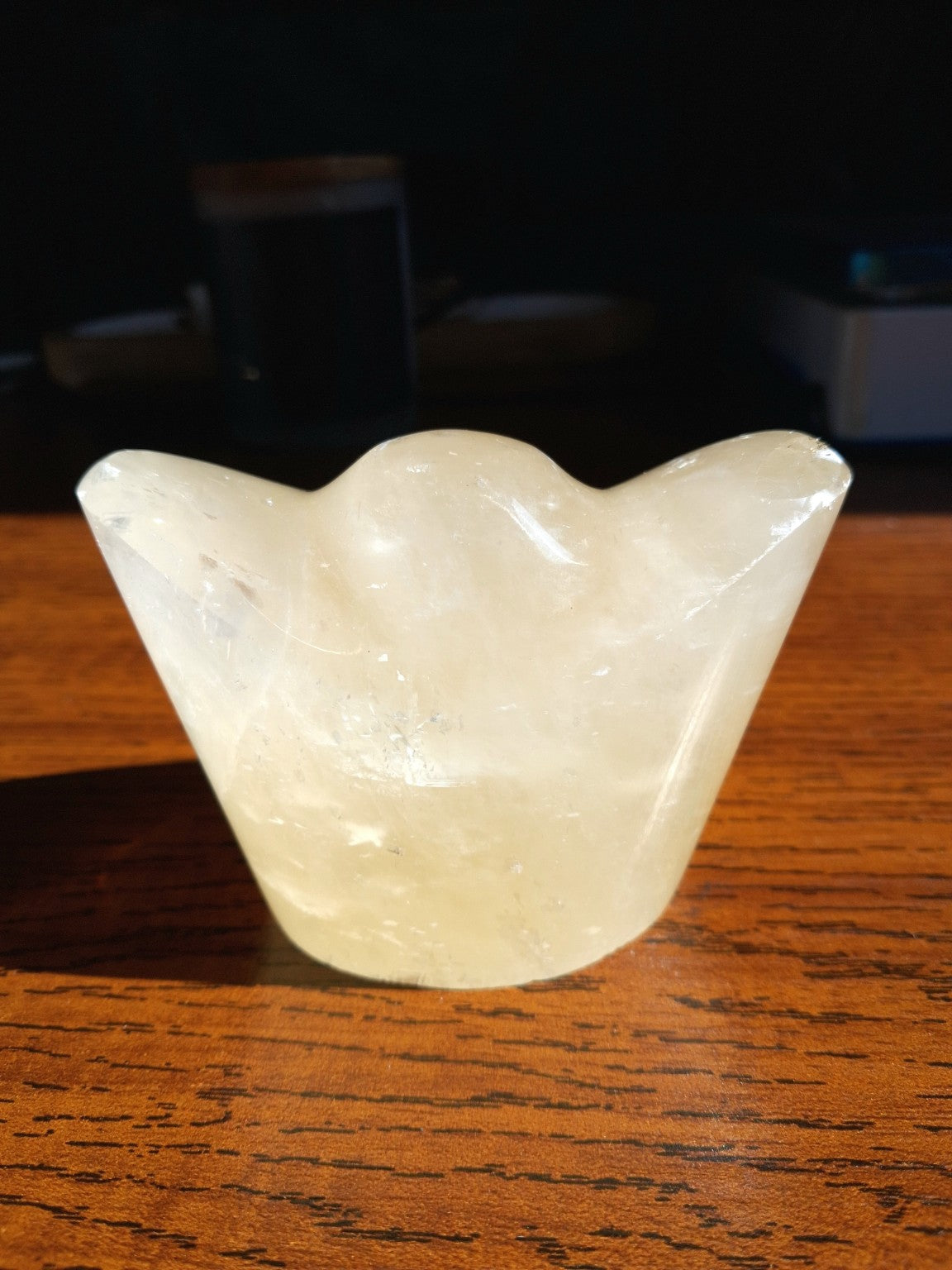 Honey Calcite Chinese wealth money ingot carved cream yellow stone with curved raised ends, second view