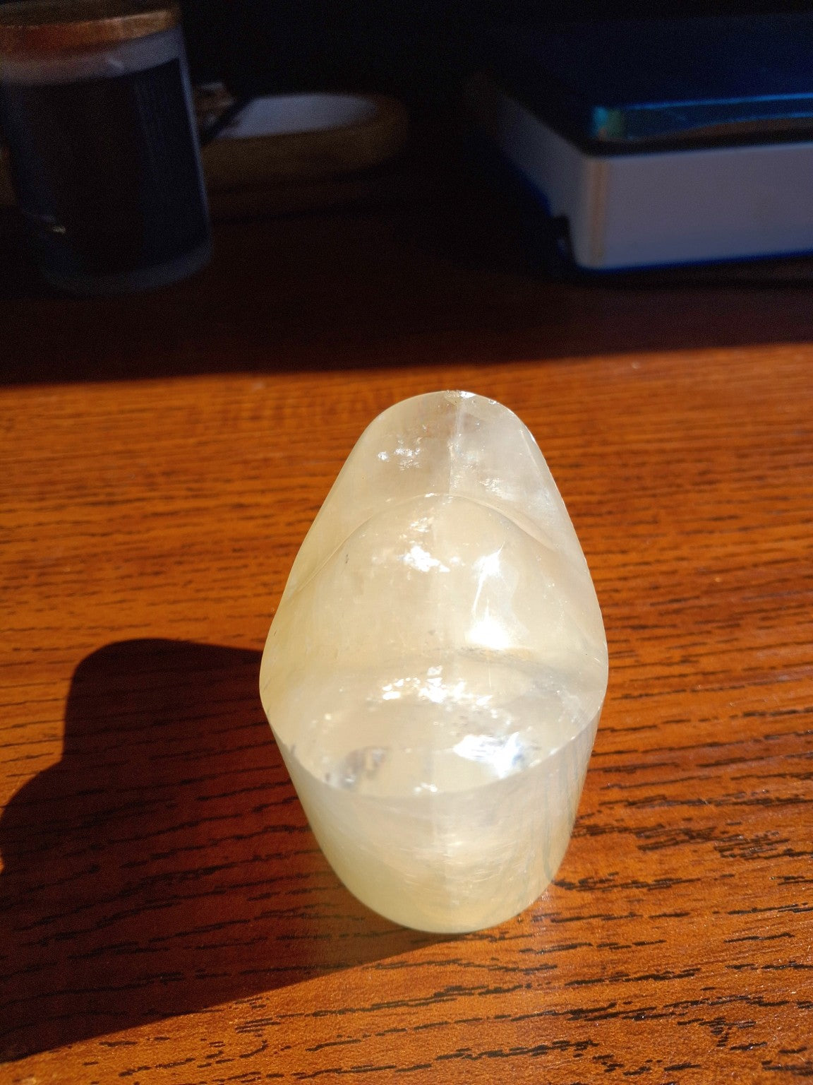 Natural Honey Calcite yuanbao ingot second frontal view in creamy honey translucent finish