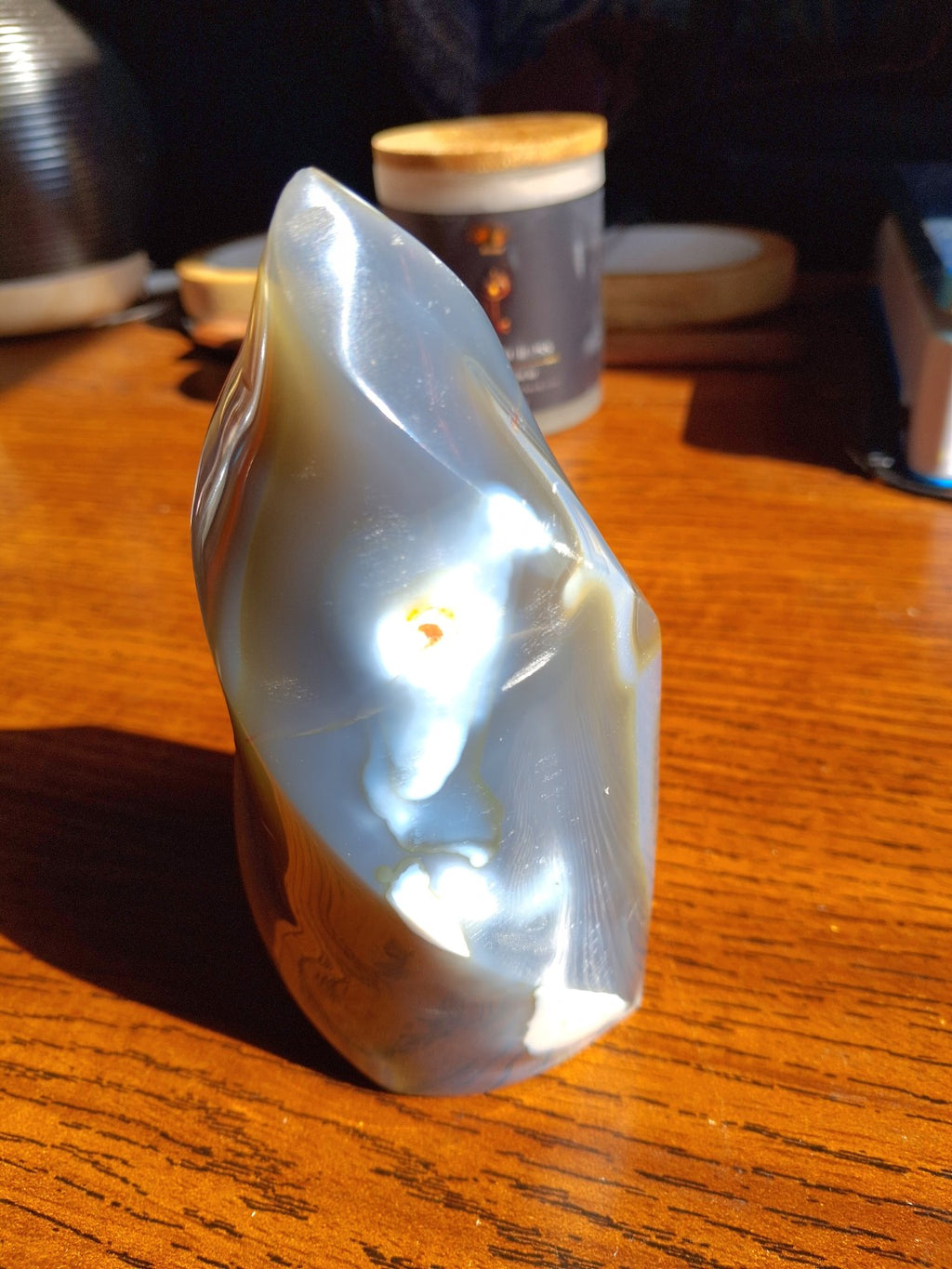 Orca Agate flame polished side with curved silhouette and natural color markings