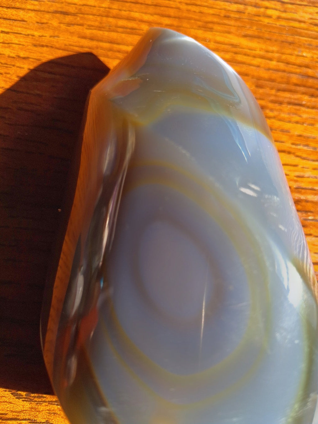 Orca Agate polished flame detail with oval eye pattern in gray and cream