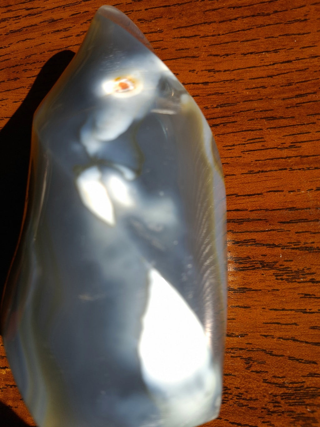 Close-up photograph of unique Orca Agate flame polished blue gray and cream detail