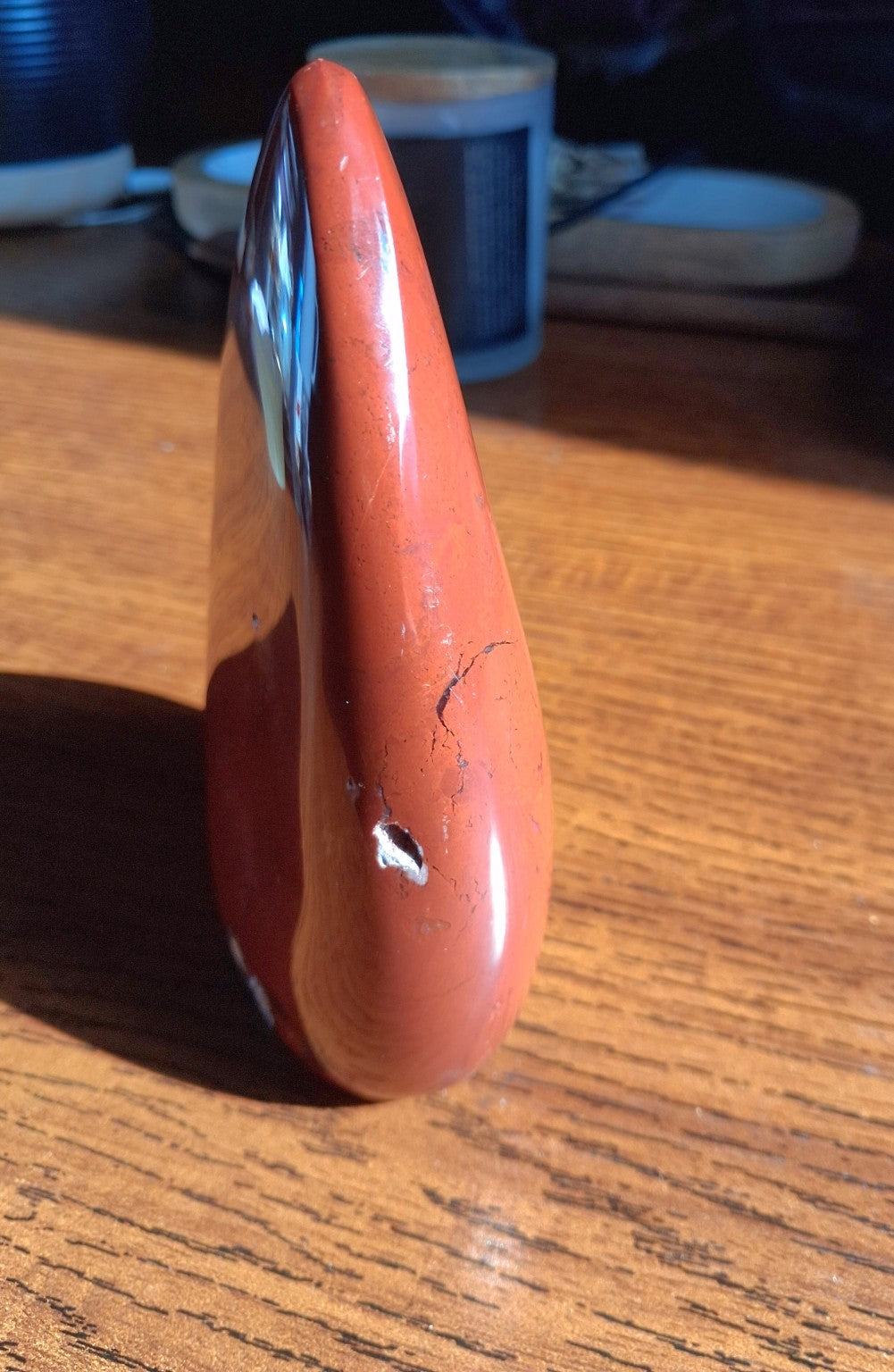 Red Jasper polished standing freeform left side view showing irregular natural markings
